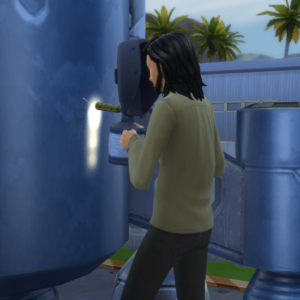 Sims welding a blue tank.