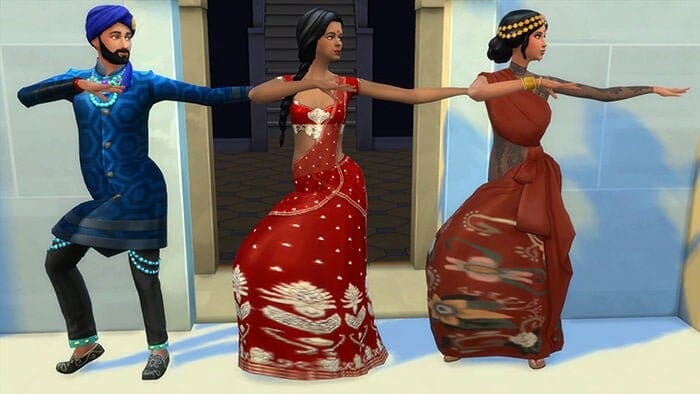 Trois Sims en tenues traditionnelles indiennes.