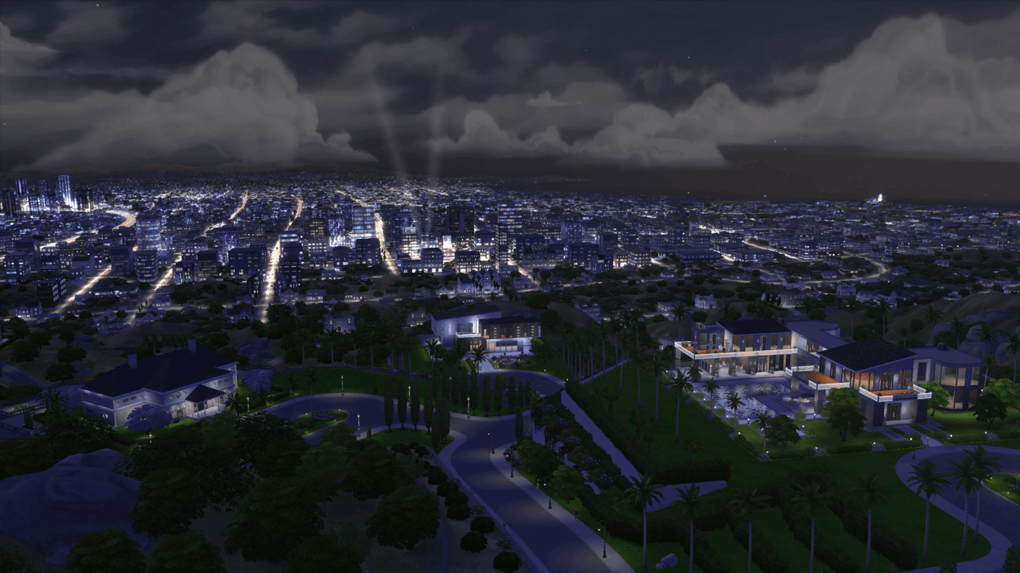Vue nocturne illuminée d'une ville étendue.