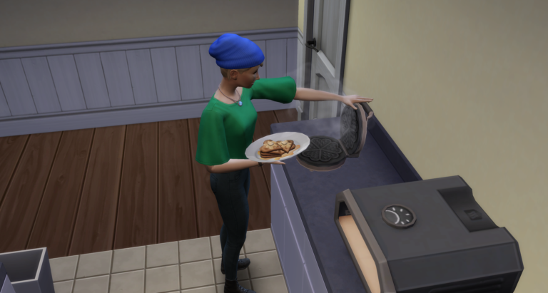 Sims prépare des gaufres dans cuisine virtuelle.