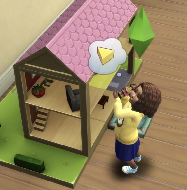 Child playing with dollhouse.