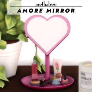 Miroir cœur rose avec maquillage