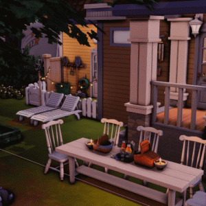 Jardin extérieur du jeu Les Sims 4 avec salon et table à manger