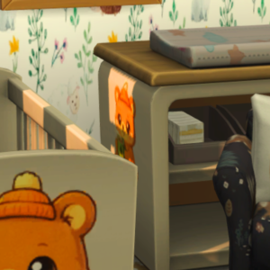 Bureau enfant *Les Sims 4* avec ourson décoratif et livres.